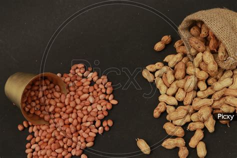 Image Of Ground Nuts In A Bag And Glass Photography Isolated On A