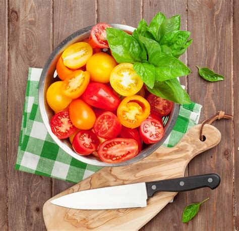 Premium Photo Fresh Colorful Tomatoes And Basil In Colander Top View