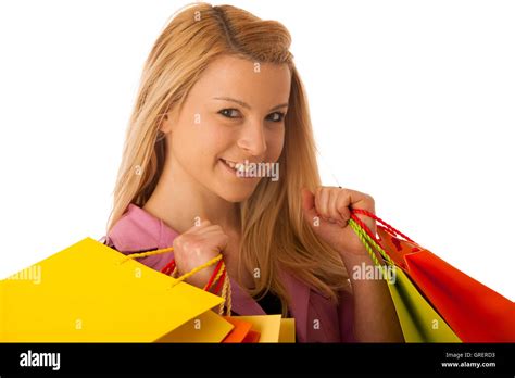 Cute Blonde Woman With Shopping Vibrant Bags Isolated Over White