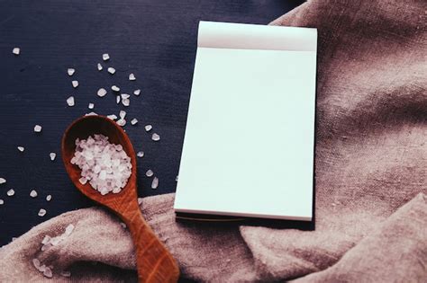 Free Photo Notebook And Sea Salt In Wooden Spoon