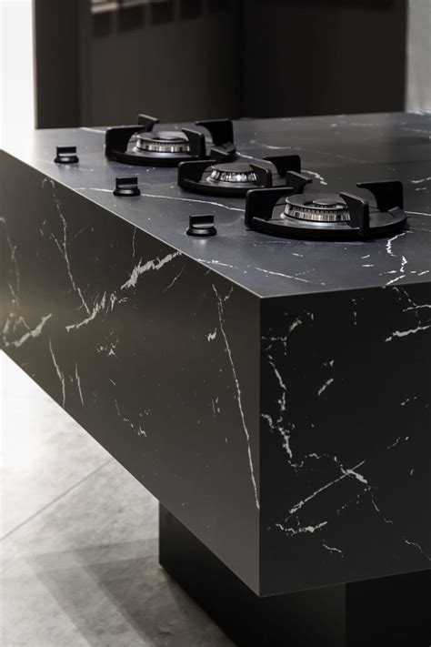 A Black Marble Table With Three Phones On It S Top And Two In The Middle