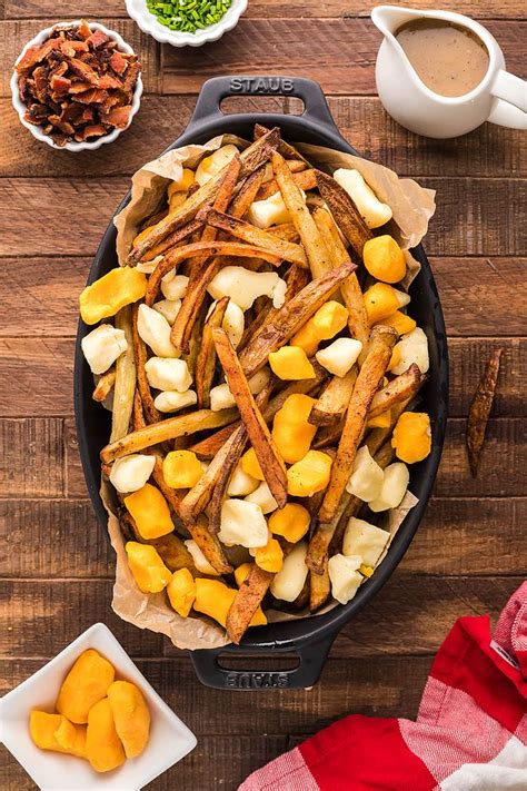 Canadian Poutine Smothered Fries With Cheese Curds Bacon And Gravy