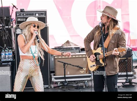 Lainey Wilson Left And Lukas Nelson Perform During The Cma Fest