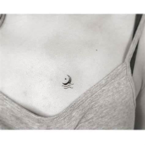 Minimalist moon tattoo on chest