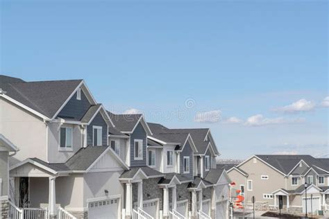 Peaceful Skyscape Of Blue Sky Over Suburban Houses On A Residential