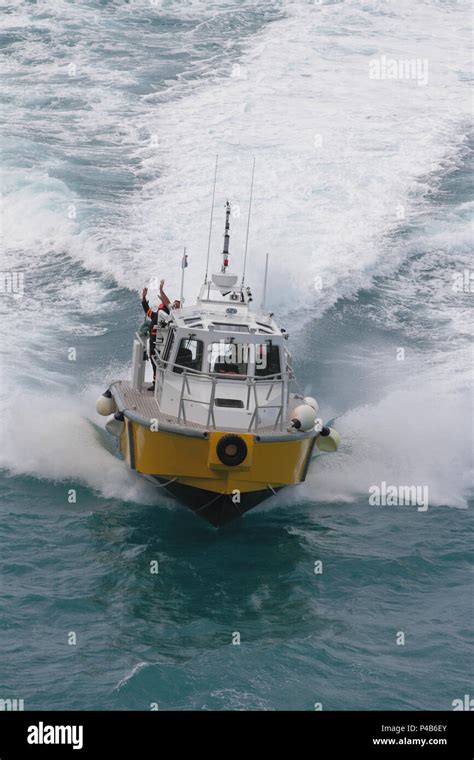 Pilot boat in full operation Stock Photo - Alamy