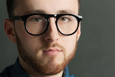 Premium Photo Close Up Portrait Of Young Man Wearing Eyeglasses