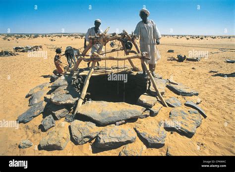 Sudan Libyan Desert Nomads To Well Stock Photo Alamy