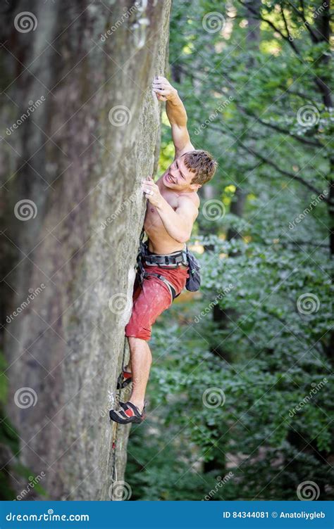 Muscular Rock Climber Climbs On Overhanging Cliff Stock Image Image