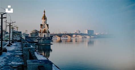 Brown And White Concrete Building Beside Body Of Water During Daytime Photo Free Grey Image On