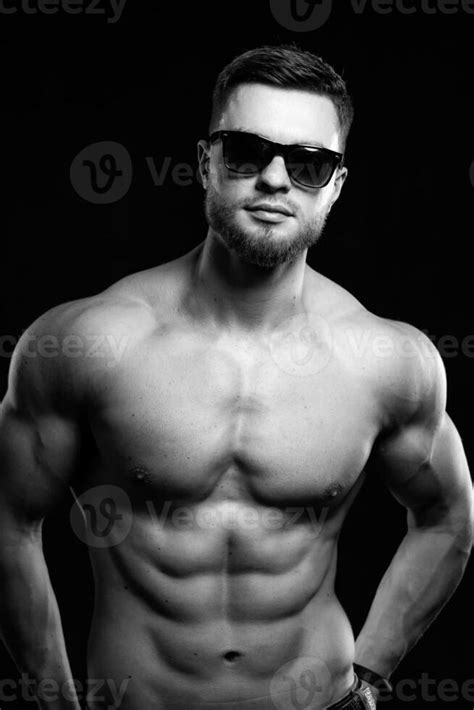 Muscular Guy With Naked Torso Posing With Hands On Waist Studio Photo