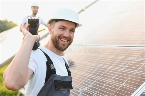 Engineering Team Working On Checking And Maintenance In Solar Power