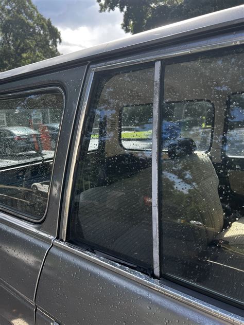 What's the procedure for replacing the small window trim on the rear