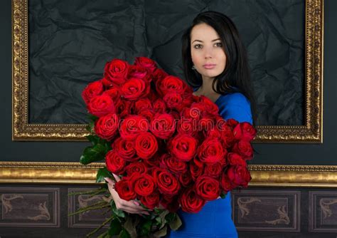 Brunette Woman With A Big Bouquet Of Red Roses Stock Image Image