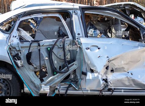 A Warped Flattened Car After An Accident After A Strong Side Impact