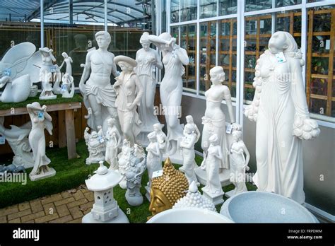 A Collection Of Garden Ornament Statues For Sale In A Garden Centre