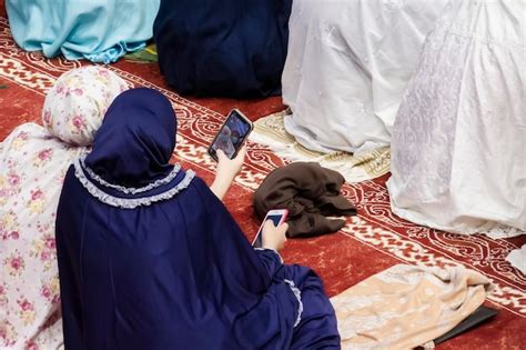 Premium Photo A High Angle View Of A Woman Sitting On A Prayer Mat