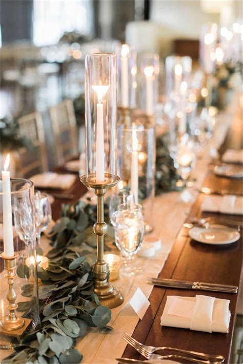 White Pillar Candles In Hurricanes And Gold Details Wedding Decor Ideas