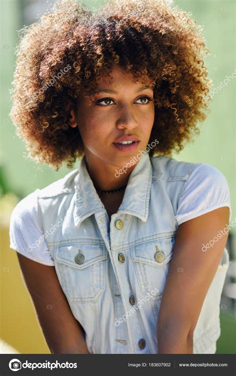 Black Woman Afro Hairstyle Wearing Casual Clothes In Urban Bac Stock