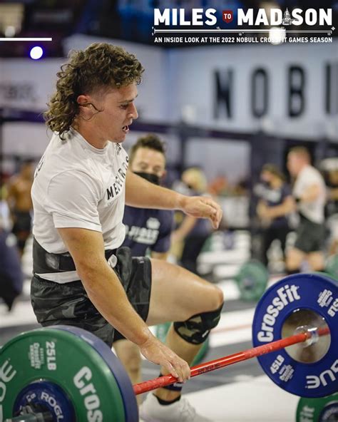 A Man Is Squatting On A Barbell