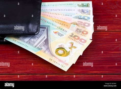 Money From Papua New Guinea In The Black Wallet Stock Photo Alamy