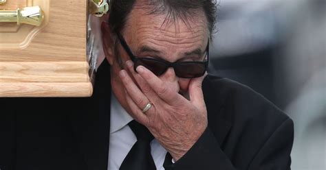 Barry Chuckle funeral: Brother Paul wipes away tears as he carries coffin into Rotherham United ...