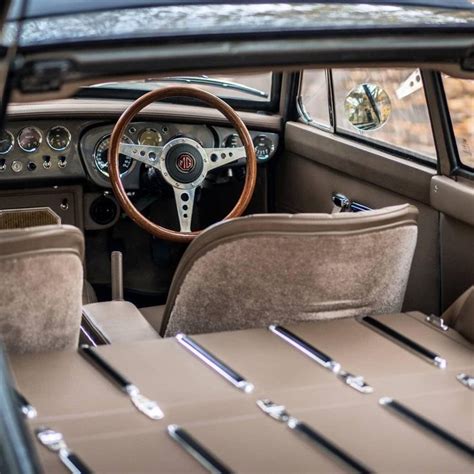 The Interior Of An Old Fashioned Car With Leather Seats And Steering