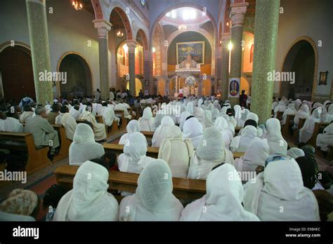 Women Dressed In White During Palm Sunday Mass In The Orthodox Catholic Cathedral Of The Holy