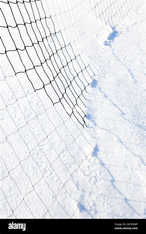 Car Tyre Tracks Left In A Deep Layer Of Snow Creating An Abstract