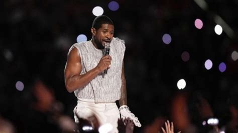 Usher performs medley of hits at Super Bowl half-time show beside ...