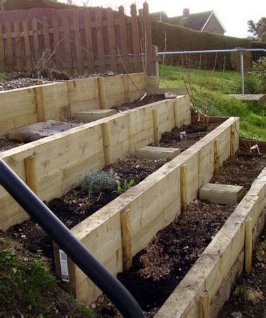 wooden terraced garden beds - Renato Bowling