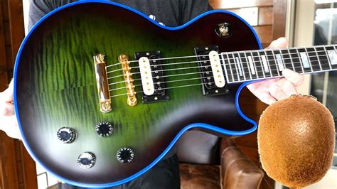 Gibsons Strangely Named Delight 2021 Les Paul Custom Axcess Kiwi Widow Burst Mod Collection