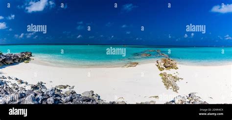 White sandy beach in Maldives with amazing blue lagoon and blue sky ...