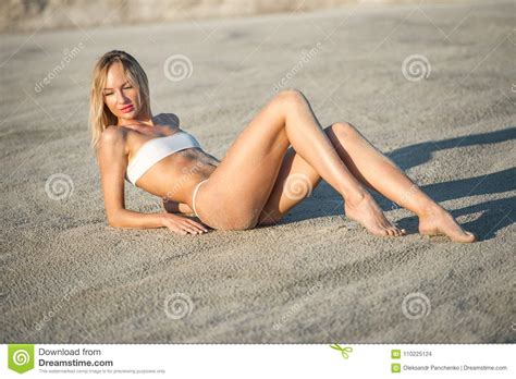 Gorgeous Woman In White Bikini Lying At The Sand With Sand Stock Photo Image Of Attractive