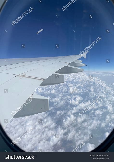 Airplane Window Seat View Above Clouds Stock Photo 2114592815 | Shutterstock