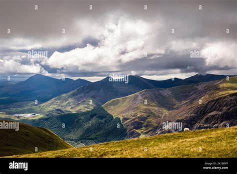 View Across Beddgelert Forest To Nantlle Ridge Mountain Range From Moel