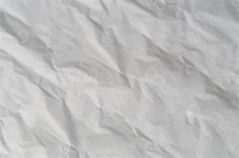 Wrinkled or crumpled white stencil paper or tissue after use in toilet or restroom with large ...