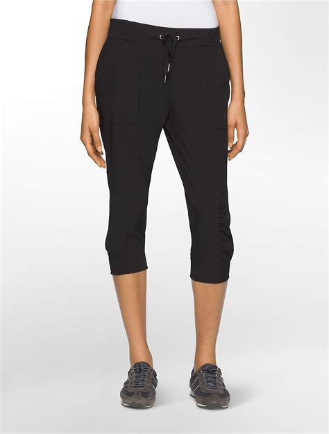 Lyst Calvin Klein Performance Commuter Ruched Capri Pants In Black