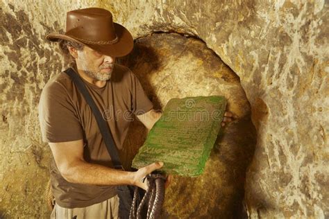 Finding Of Tabula Smaragdina In Abandoned Cave Sanctuary Stock Photo