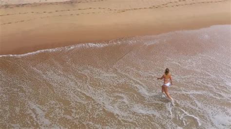 Sexy Woman In A Bikini Walks Over A Sand Stock Video Pond
