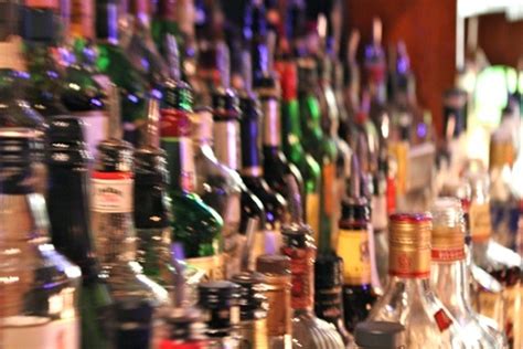 Many Bottles Of Alcohol Are Lined Up On The Bar