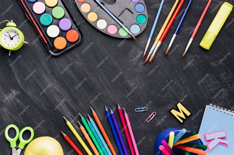 Premium Photo | Colourful stationery for painting on dark background