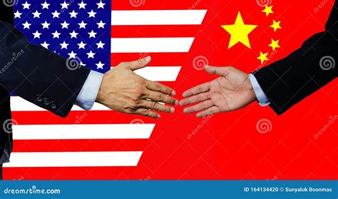 An American And Chinese Business Man Make The Handshake Each Other Hand