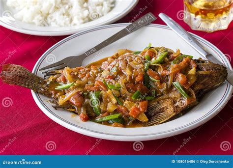 Spicy Carp Fish Fried In Sauce With Vegetables Served On Plate In Asian