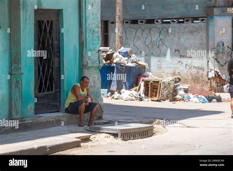 Havana, Cuba, 2023, Man sitting in doorstep Stock Photo - Alamy