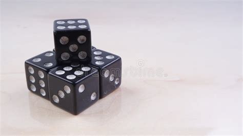 Black Dice With White Dots Isolated On White Background Stock Photo