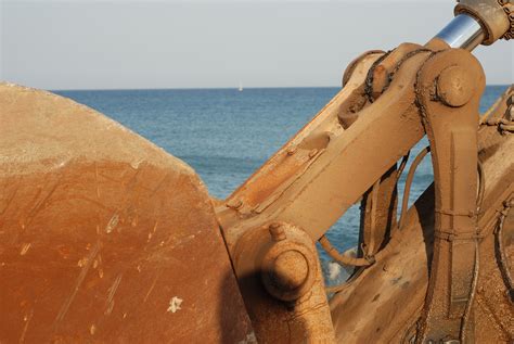 Free Images Beach Sea Sand Rock Sky Wood Rust Construction