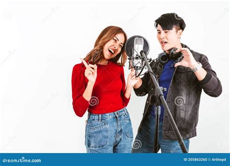 Pretty Asian Female And Male Singers Recording Songs By Using A Studio