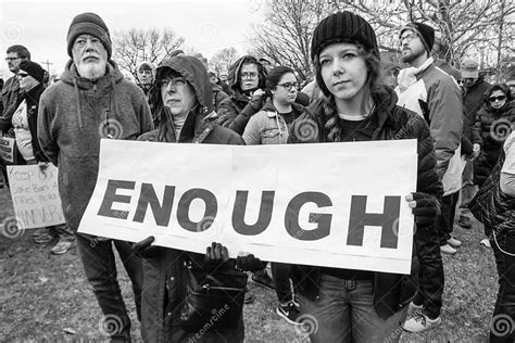 People Hold Sign That Says Enough At March For Our Lives In Columbus