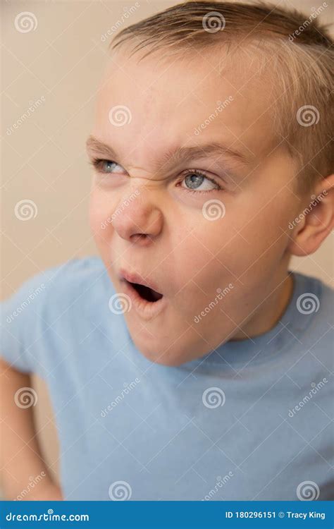 Young Boy Making a Funny Face while Playing Around Stock Image - Image ...